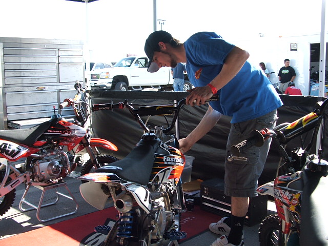 Joel, a rider for the Fast50's Team, checks out his bike before practice. Where's Ray??? Is Aaron slackin off again?

